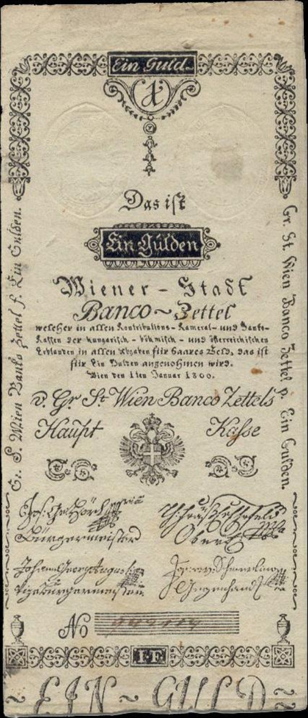 Old German banknote with a black background featuring a man's face and the text "St. Wien - Stäse Banco-Settel".