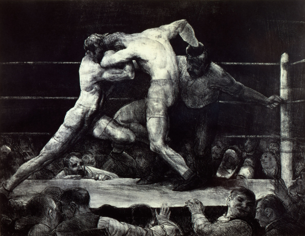 Two boxers in a boxing ring exchange punches as a cheering crowd watches.