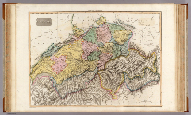 Ein altes Buch mit einer detaillierten Karte von Schweiz und umliegenden Ländern und Regionen, begleitet von Erklärungstext.