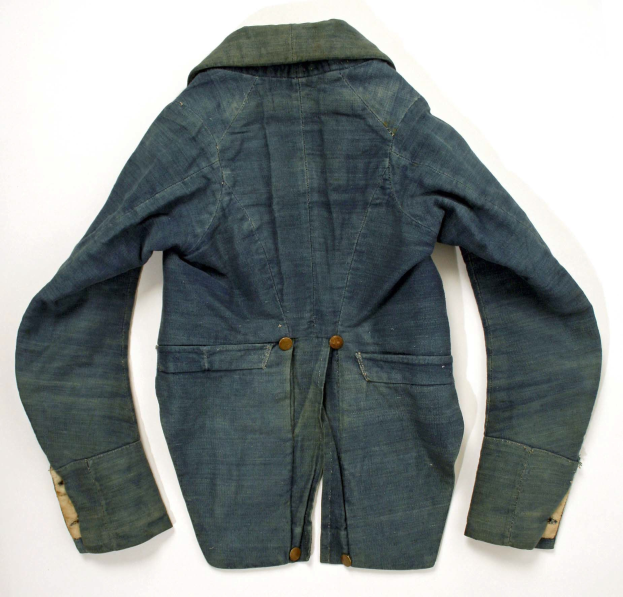 A light blue denim jacket with a collar, long sleeves, and two front pockets, displayed on a white background.