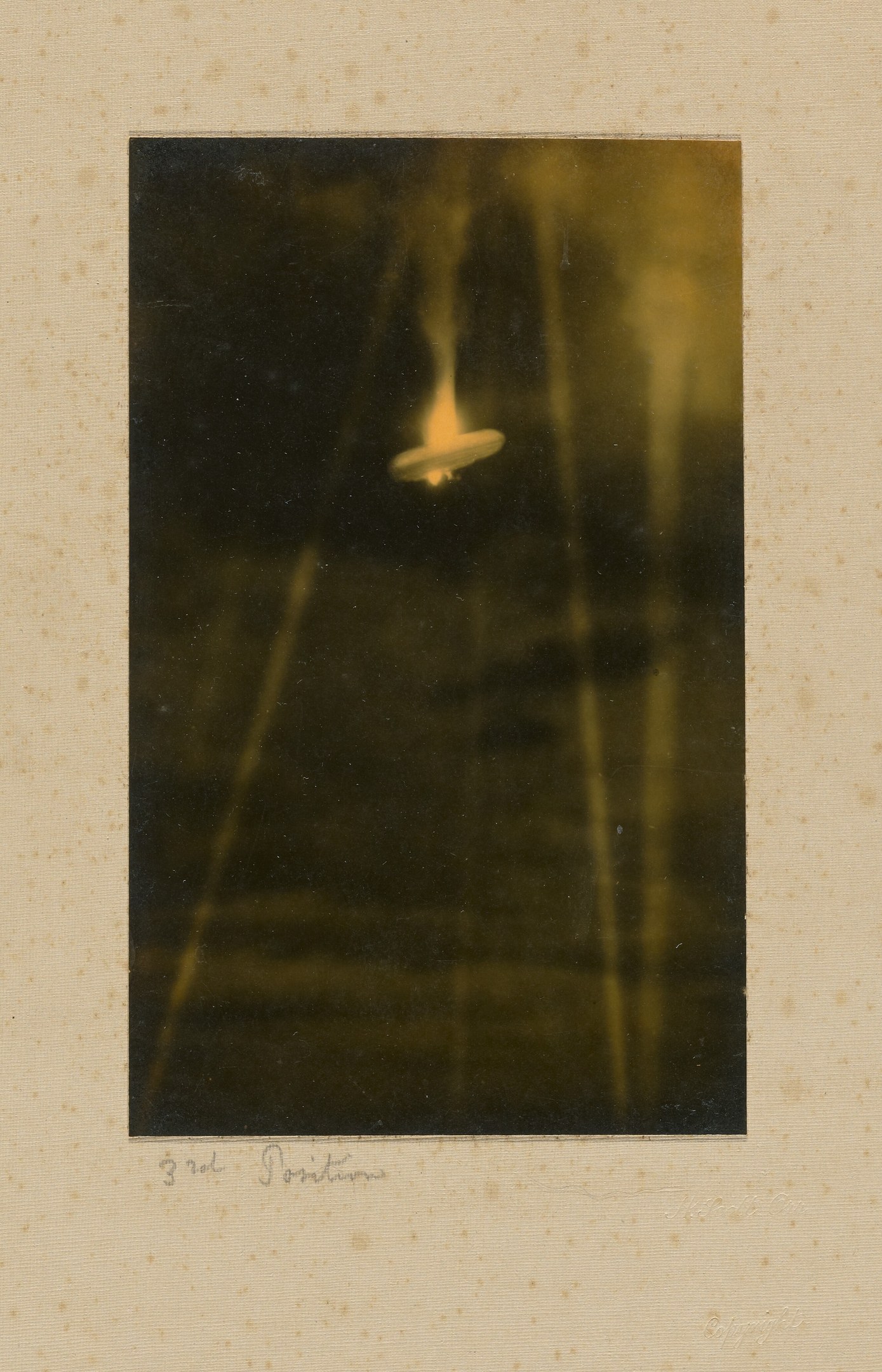 Black and white photo of a UFO flying over a body of water with text at the bottom.