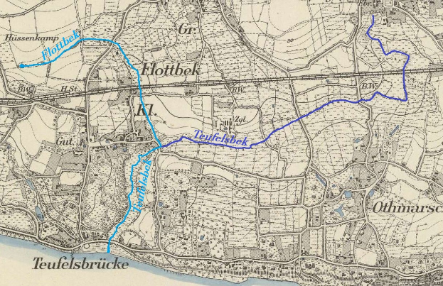 Detailed old map of Teufelsbrucke with a blue line running through it, showing streets, buildings, and landmarks.