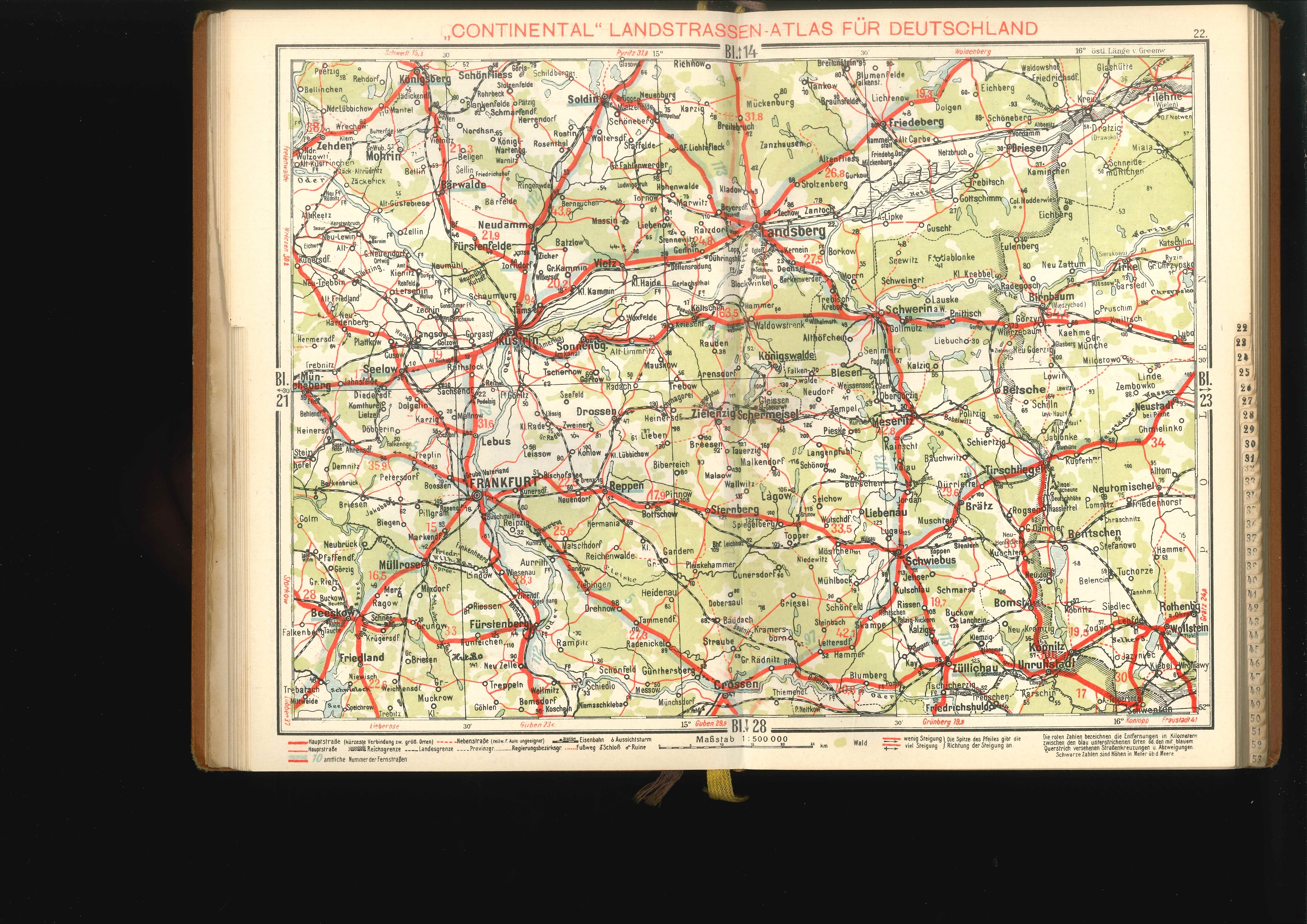 Open book displaying a detailed map of Germany's roads and highways against a black background.