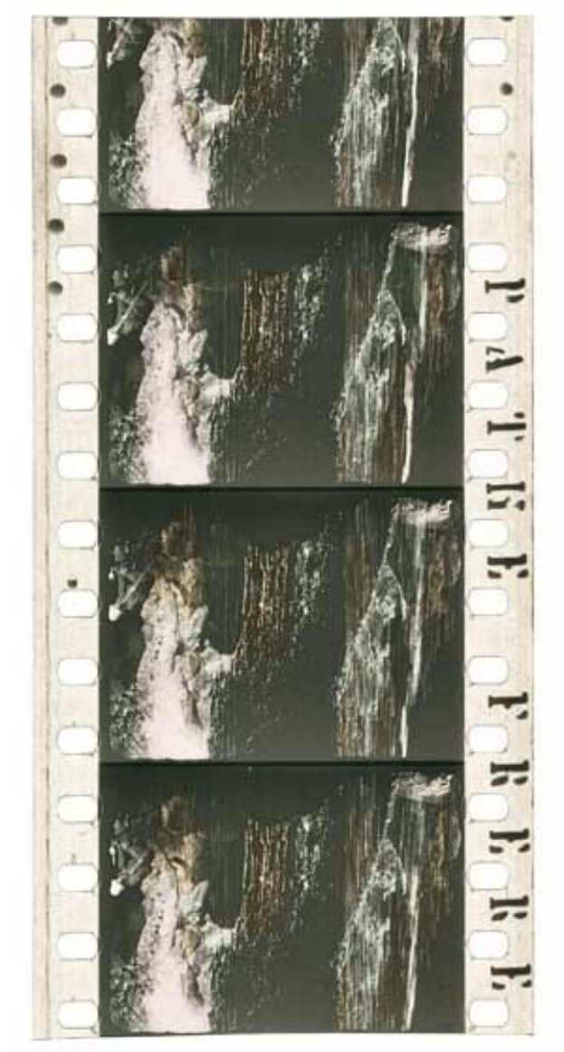 Film strip featuring a black and white waterfall cascading down a rocky cliff, with "ARTIST" in bold text at the top, surrounded by green trees and shrubs under a deep blue sky with a setting sun casting an orange glow.