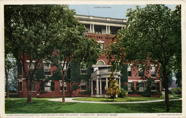 Black-and-white postcard of the New England Hospital for Women and Children in Boston, Massachusetts, showing a large building with windows, pillars, and arches, surrounded by trees and plants under a clear blue sky, with text at the bottom.