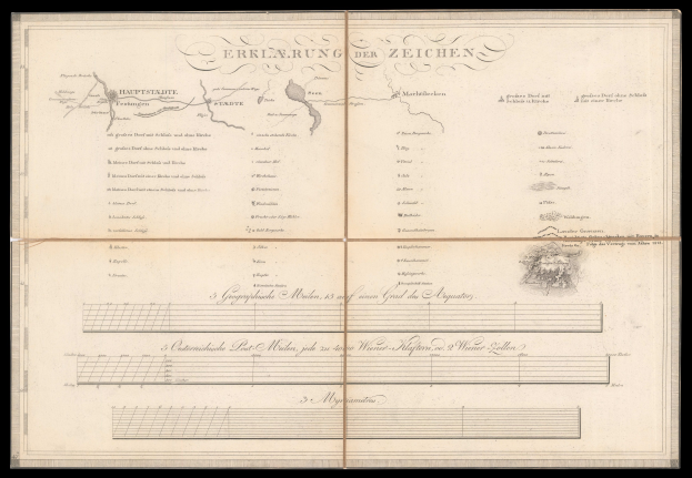 Ein altes Buch mit schwarzem Einband und einer Deutschlandkarte, aufgeschlagen bei einer Text- und Zeichnungseite.