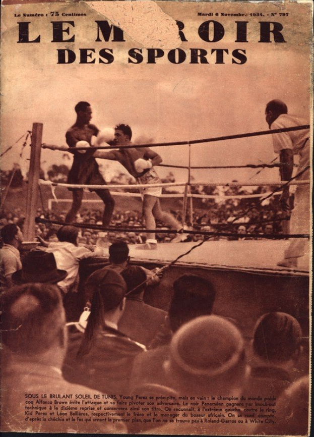 Black and white photo of two boxers in a ring with a crowd, featuring the text "Le Roi des Sports" at the top.