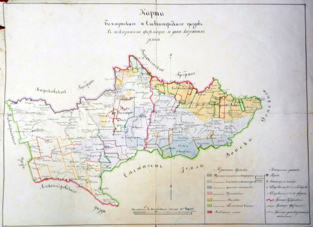 An old book featuring a detailed map of Ukraine, including its provinces and cities, with accompanying text.