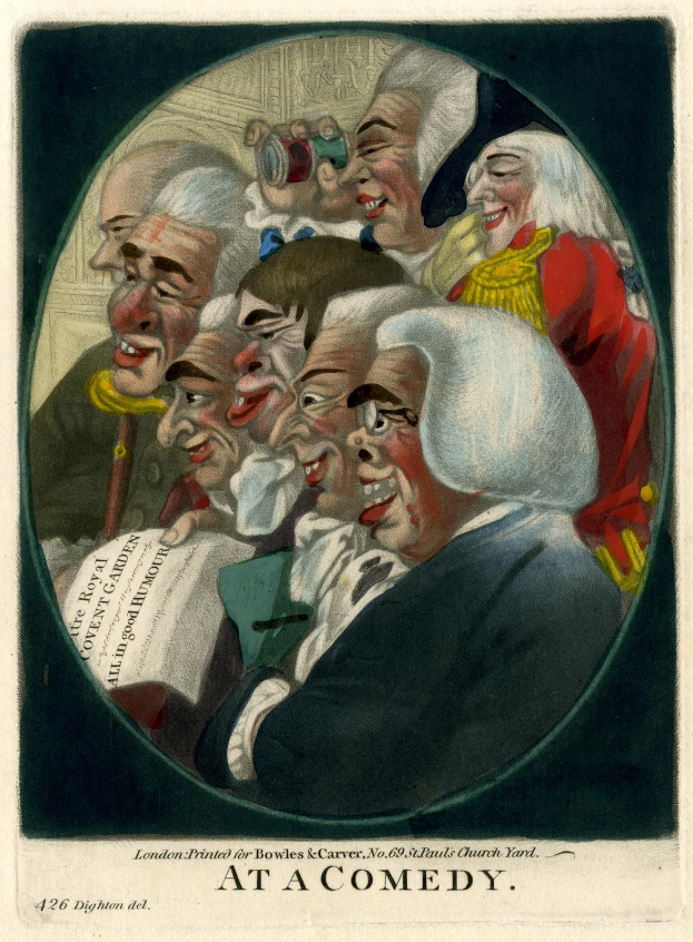 A group of people standing in a circle laughing, with one person holding a piece of paper, and the text "At a Comedy" at the bottom.