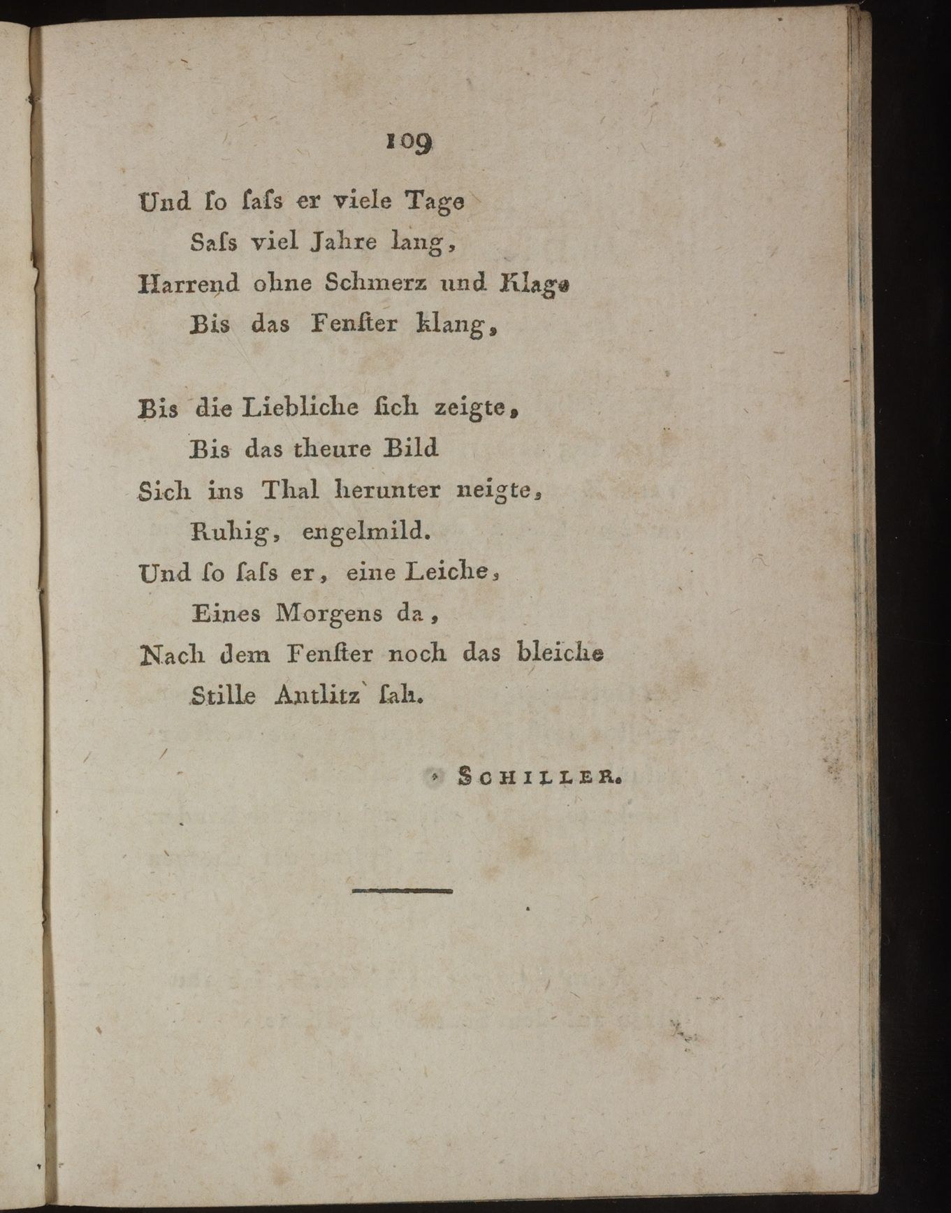 Open book with black background titled "Schiller, Johann Wolfgang von Schiller" displaying the likely title of a poem on its page.