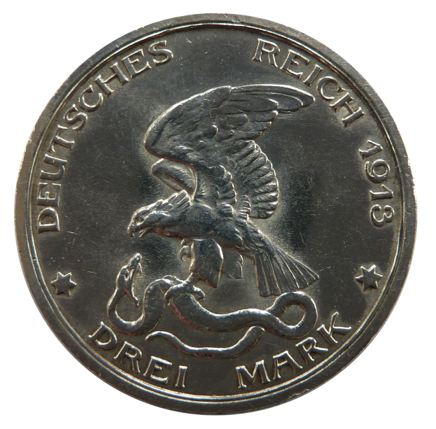 Silbermünze mit einem ausgebreiteten Adler, der eine Schlange hält, Text lautet "Deutsches Reich" auf weißem Hintergrund.