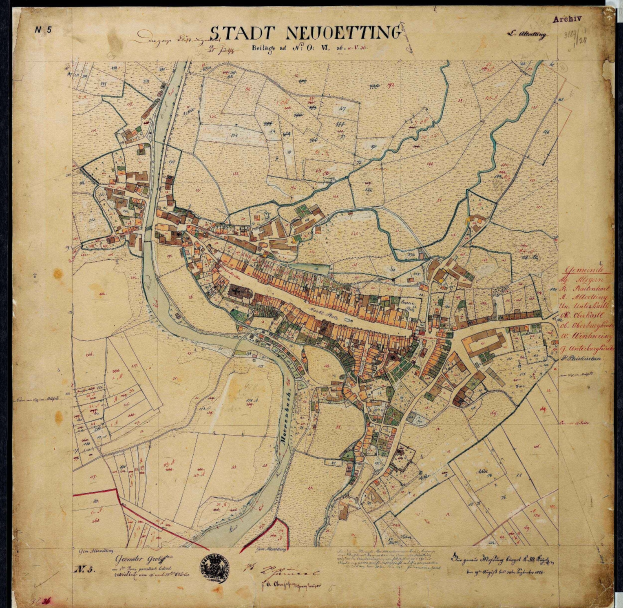 Detailed old map of Stadt Neuetting, Germany, framed in a photo frame, showing streets, buildings, and landmarks.